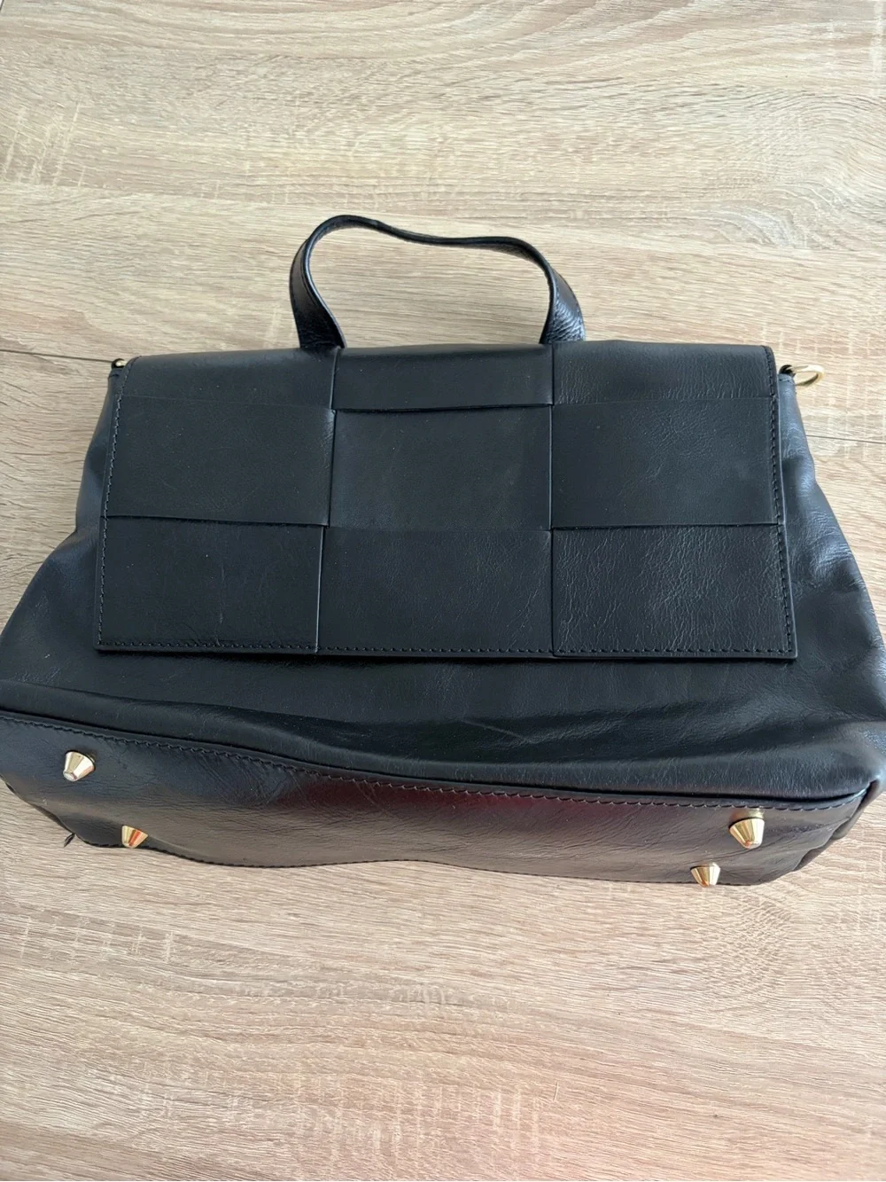 Structured Black Leather Top-Handle Satchel with Woven Flap Detail